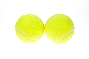 two tennis balls on a white background