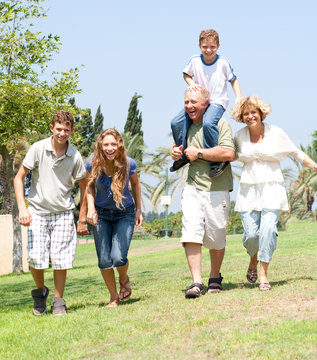 Happy Family Running Towards Camera