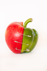 Merge of apple and pepper - isolated on white