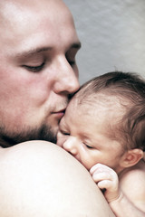 Father kiss lovely his  baby