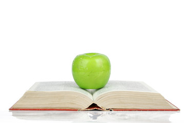 Green apple with books
