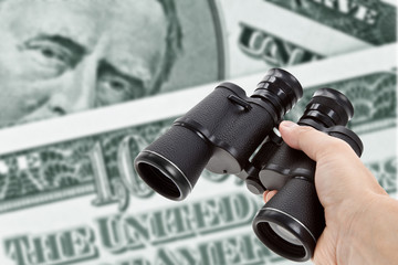 Binoculars and dollar