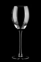 Empty wine glass, isolated on a black background.