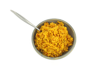Seasoned rice in stoneware bowl with fork