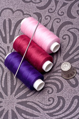 colored thread for sewing with needle and thimble