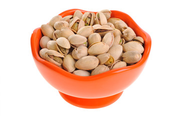 pistachio in a bowl on a white background