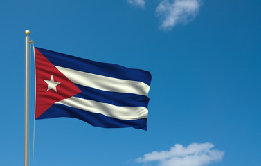 Flag of Cuba waving in the wind in front of blue sky