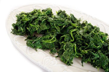 boiled spinach on dish-spinaci bolliti