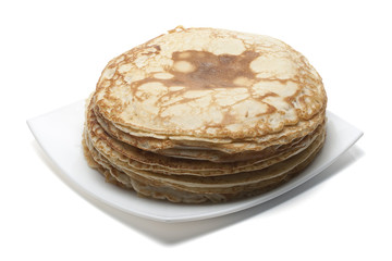 heap of pancakes on white plate