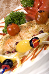 Fried filleted fish with lemon and vegetables