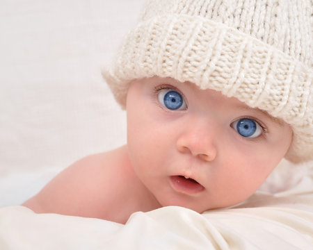 Cute Baby Looking with White Hat