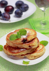 Blinis (from white flour, with plum) on plate