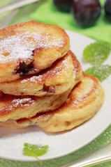 Blinis (from white flour, with plum) on plate