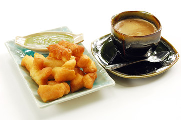 Deep-fried doughstick and local coffee