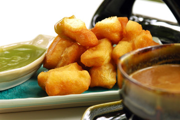 Deep-fried doughstick and local coffee