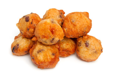 Dutch donut also known as oliebollen over white background