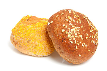 two home baked buns over white background