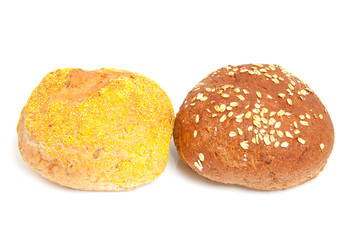 two home baked buns over white background