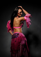Beautiful sexy dancer woman in bellydance costume with pretty pr