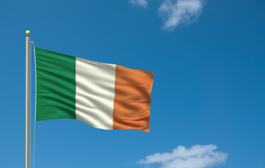 Flag of Ireland waving in the wind in front of blue sky