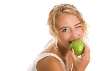 Woman eating green apple