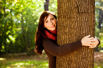 tree embracing female