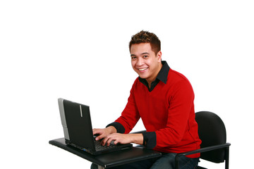 smiling asian guy on laptop