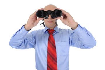 Businessman looking through binoculars