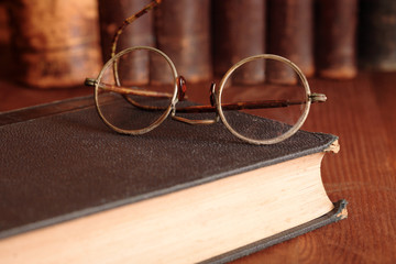 Old Eyeglasses On Bookshelf