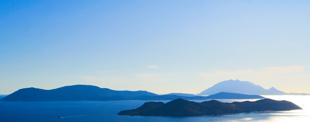 Ship, the sea and islands in a haze