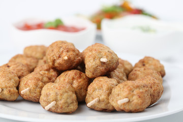 Roast meatballs with tzatziki and tomato dip and salad