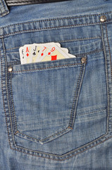 Playing cards in jeans pocket