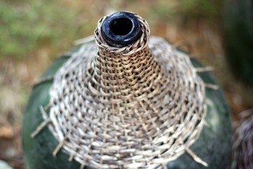 Open bottle with twiggen mouth
