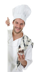 Young attractive caucasian man chef, cake