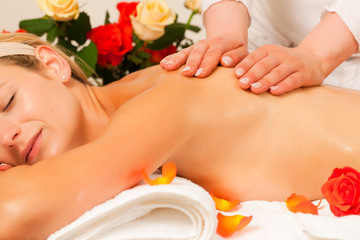 Woman enjoying wellness back massage