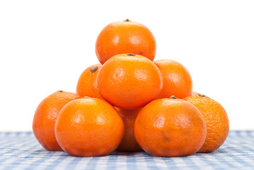 Stack of Tangerine Oranges on Picnic Blanket