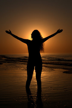 Silhouette of a woman on the beach