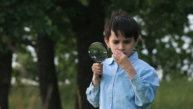 The boy with a magnifier