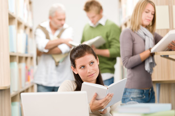 High school library - Student with book