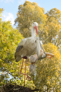 stork figure  with toy baby.fun view