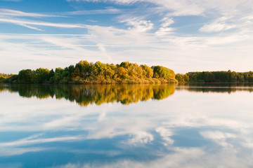 Fototapeta na wymiar Autumn landscape of river and bright trees