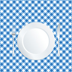 plate on blue tablecloth