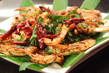 Spicy chili crab served with garnishing