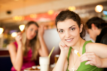 Friends in Restaurant eating fast food