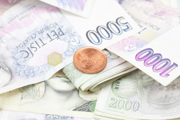 stack of paper money and coins