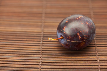 Plum on a bamboo mat