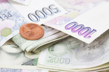 stack of paper money and coins