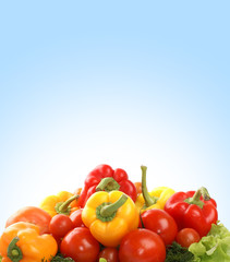 A pile of fresh and tasty vegetables on a white background