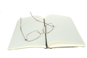 a notebook with blank paper