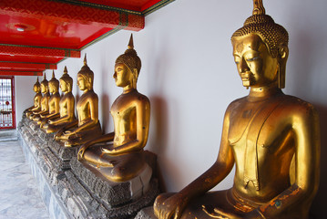 Row of Golden Buddha statue in Thailand Buddha Temple